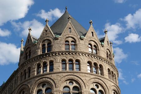 the old grain and exchange building in boston on a bright sunny day with a deep blue sky and soft white cloudsの写真素材