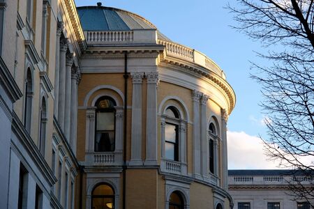 unusual view of the massachusetts state house in boston as the sun setsの写真素材