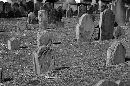 collection of weathered flaking tombstones in boston's granary cemetery, one of the oldest in the countryの写真素材