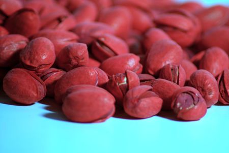 Close up of red pistachio nuts on flat surfaceの写真素材