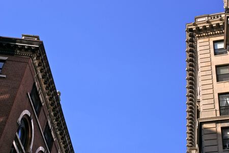 blue sky above old boston high rise apartment buildings