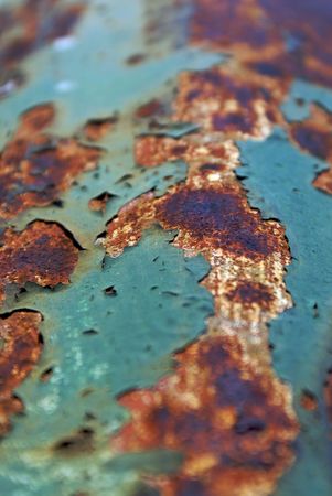 close up macro abstract shot of peeling paint and rust on old iron bridgeの写真素材