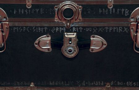 rusted old trunk with broken lock and strange mysterious  inscriptionの写真素材