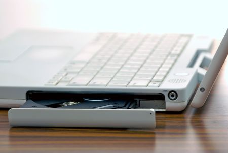 disk drive on laptop opening so cd or dvd can be put inの写真素材