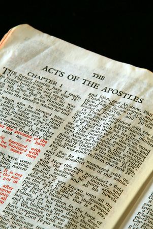 Bible Series. close up detail of antique holy bible open to the gospel according to the acts of the apostles in the new testamentの写真素材