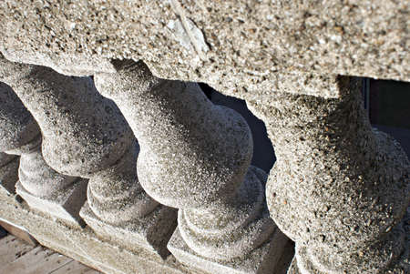 worn cement pillars at an angle shot in morning lightの写真素材