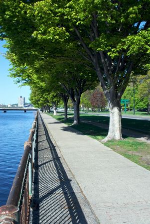 pedestrian walkway along the banks of the charles river