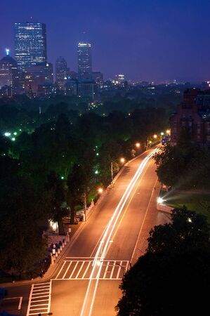 night time in boston massachusetts showing the skyline and traffic trails from cars on beacon streetの写真素材