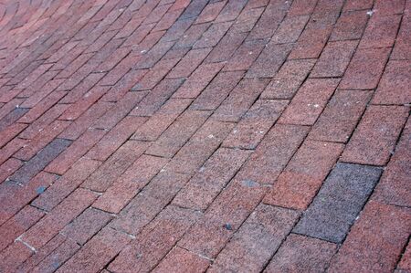 curving brick sidewalk arcing through image suitable as background imageの写真素材