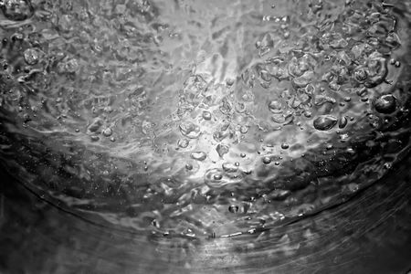 abstract image of pot of very hot water being brought to a high rolling boilの写真素材