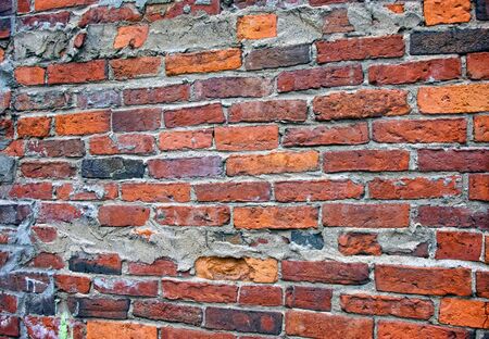 old worn brick wall on outside of building