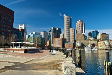 view of boston harbor and rowes wharf and skyscraper buildings in boston massachusettsの写真素材