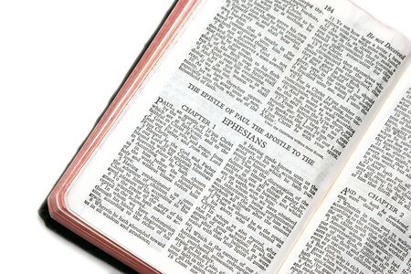 holy bible open to the epistle of paul the apostle to the ephesians, against a white backgroundの写真素材