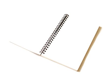a blank spiral note book or journal is open on whiteの写真素材