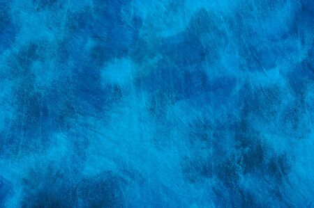 Tie dyed mottled blue background image.の写真素材