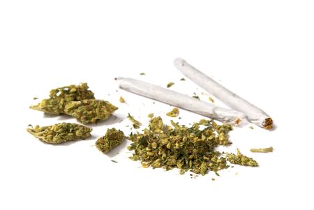 two joints and a stash of marijuana on white background                     の写真素材