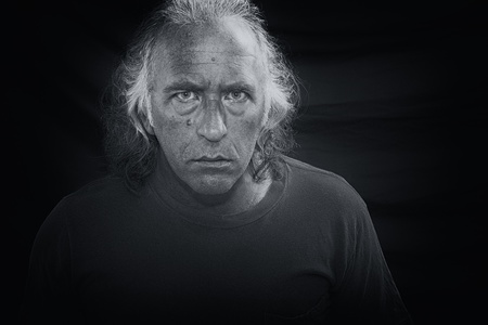 Black and white portrait of a scary looking man staring directly at viewer.の写真素材