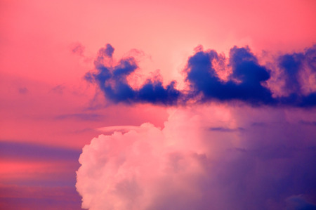 The sun setting to the left lights the sky in pastel shades of pink, blue and white over southern florida.の写真素材