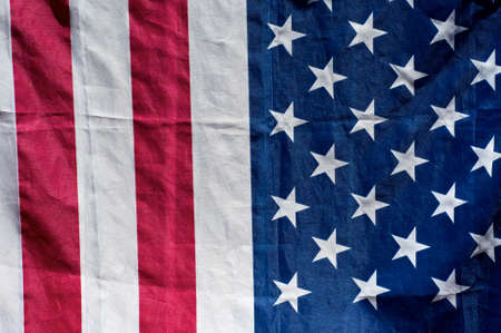 close up of american flag in sunshine, half stars, half stripes.の写真素材