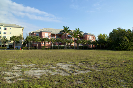 View of typical generic apartment buildings or condos in sub tropical Bonita Springs florida on a sunny winter morning.の写真素材