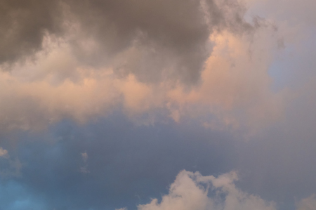 View of dramatic swirling storm clouds in sky at sunset in bonita springs florida.の写真素材