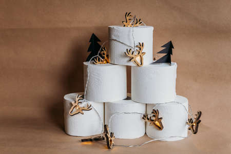 chocolate christmas cake on the wooden bord with mandarins sprinkled wit sugar powderの写真素材