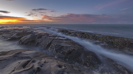 The beautiful scenery of the dusk in Kudat Sabah Borneo. Long exposure photograph with grain. Image contain certain grain or noise and soft focus.の写真素材