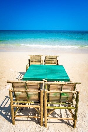 Chairs and table on Clear water and beautiful White Sand Beach.の写真素材