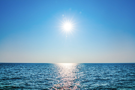 Rays of Sunshine in day of clear sky on sea.の写真素材