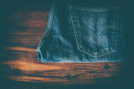 Blue Jeans on a wooden table.の写真素材