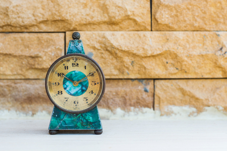 vintage old desk clock on floor.の写真素材