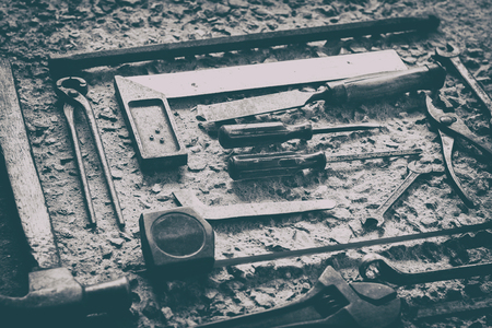 Old Tools set Placed on the cement floor, White and Black color tone.の写真素材