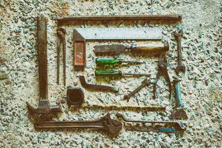 Old Tools set Placed on the cement floor, vintage color tone.の写真素材