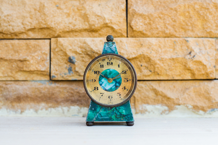 vintage old desk clock on floor.の写真素材