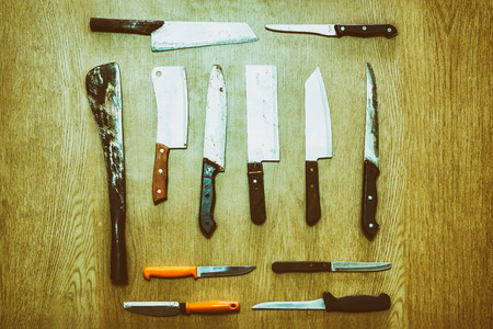 Old knife set on the wooden floor.の写真素材