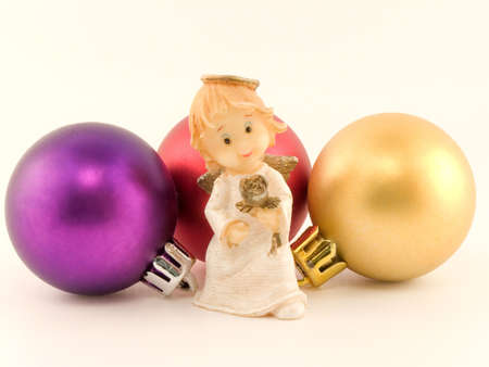 Christmas angel with new-year toys on a white backgroundの写真素材