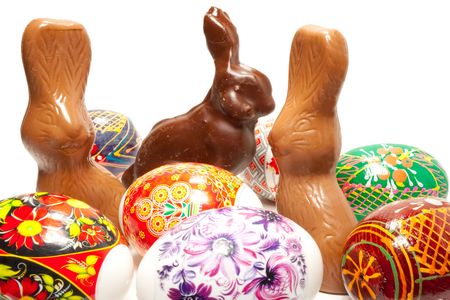 Chocolate easter rabbit in surroundings easter eggs