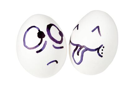 Ludicrous images of human persons on chicken eggsの写真素材