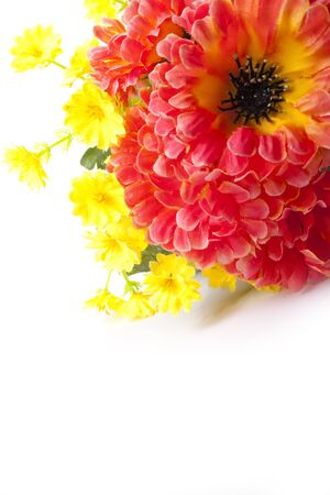 artificial bouquet red and yellow flower on white backgroundの写真素材