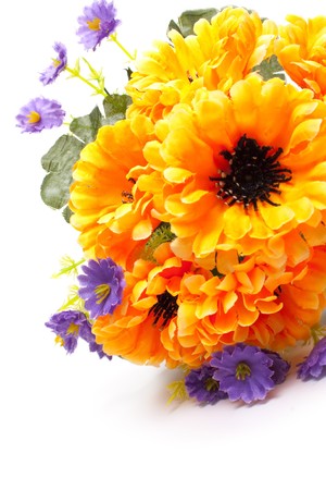 artificial bouquet orange and violet flower on white background の写真素材