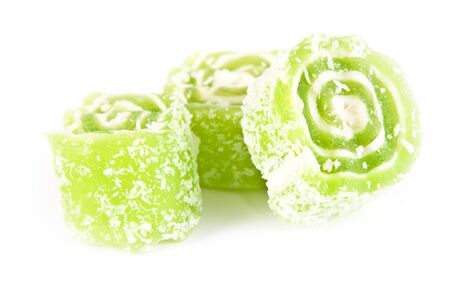 Fruit jellies. Green jelly candies isolated on a white backgroundの写真素材