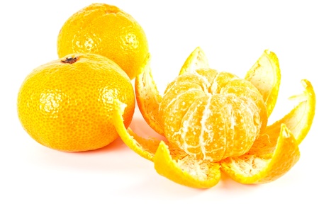 Tropical fruit. Tangerine with the taken off skin on a white backgroundの写真素材