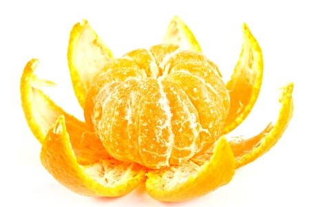 Tropical fruit. Tangerine with the taken off skin on a white backgroundの写真素材