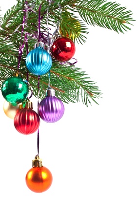 Christmas and new-year decorations. Fir tree branch with decoration on a white backgroundの写真素材