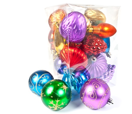 Christmas and new-year decorations. Varicoloured christmas balls in a box, on white background.の写真素材