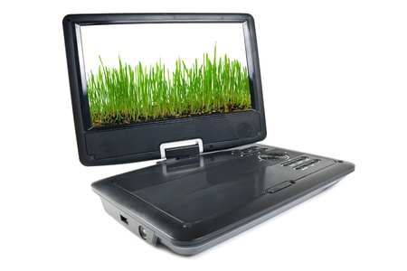 Portable dvd player isolated on white background with to the images of grass on a monitorの写真素材