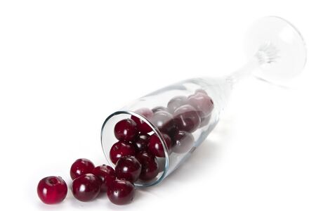 cherries are rolled out from the disappointed caldron glassの写真素材