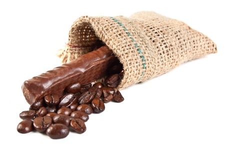 chocolate candies and coffee beans in a linen sac isolated on white backgroundの写真素材