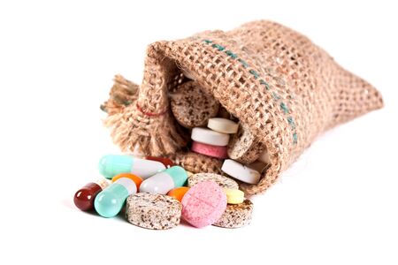 Medical tablets, pills and vitamins isolated on white backgroundの写真素材