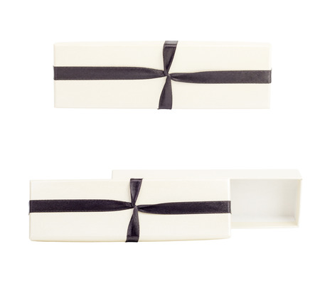 White box with a bow, studio photo of white box wrapping ribbon - on white background.の写真素材